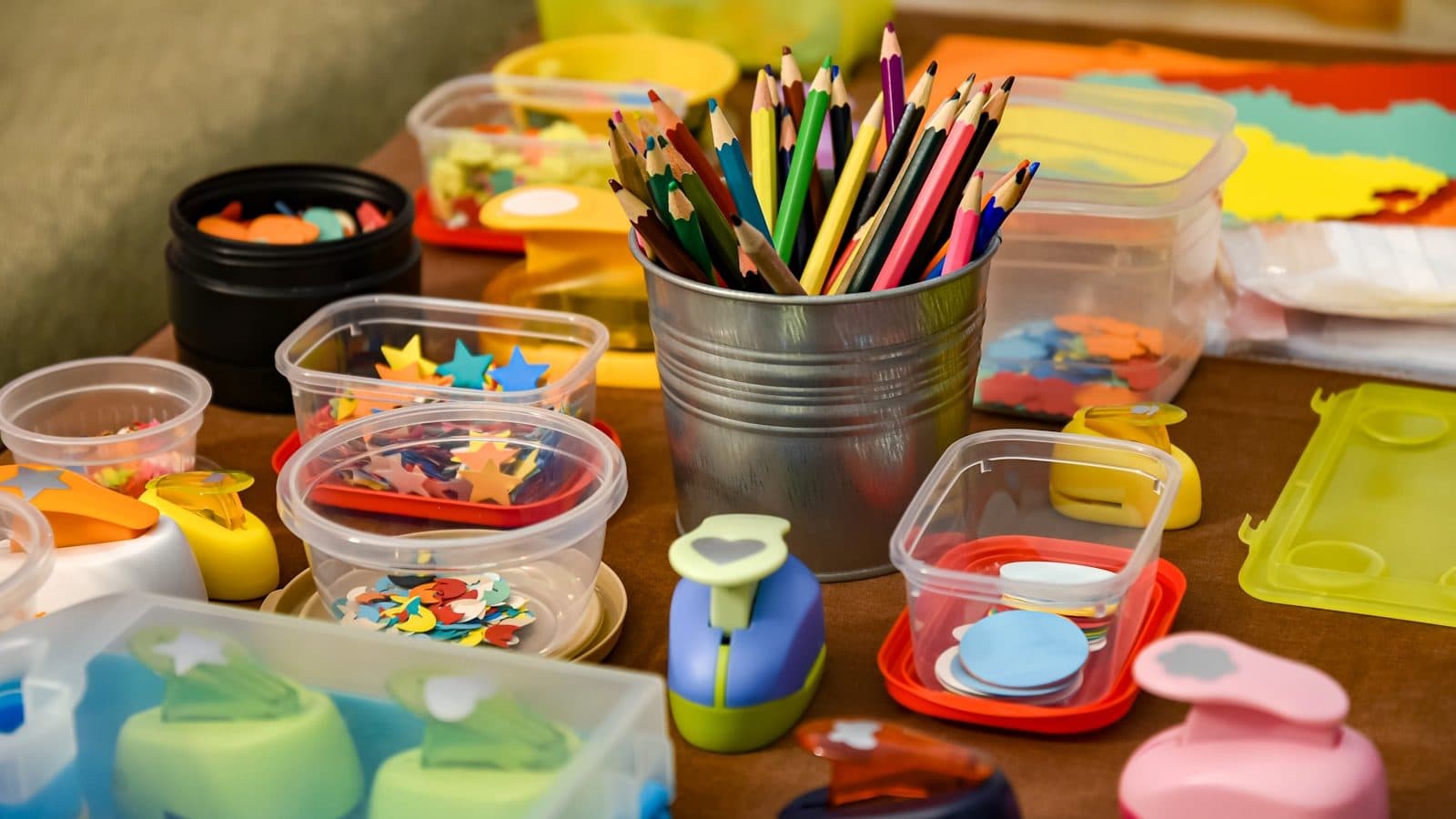 assorted color pencils in clear plastic container